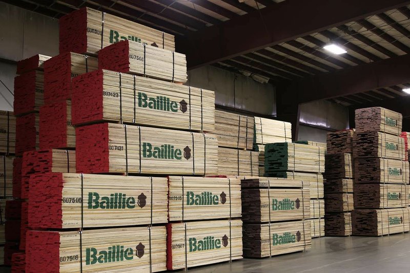 Bundled hardwood lumber stacked in the warehouse, ready to route to the right rep